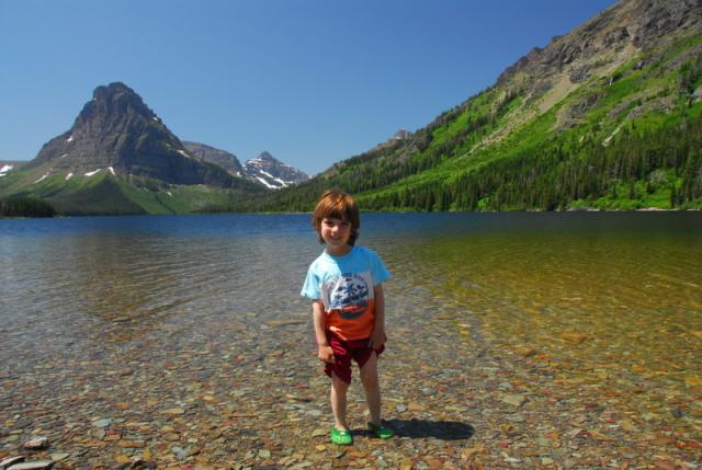 Ron checking te water at Two Medicine Lake, Glacier aAtional Park